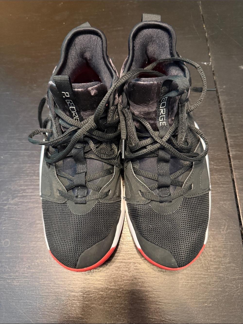 Nike Kids Black Sneakers with Red Toe Accent